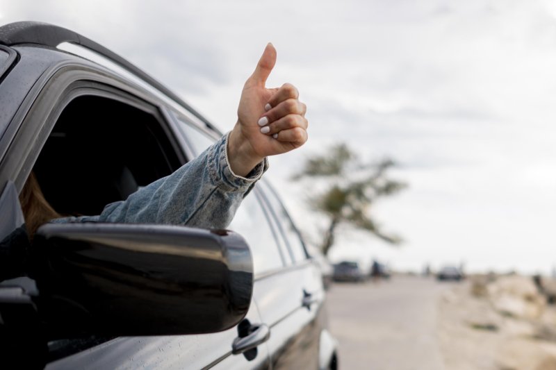 young-woman-enjoying-road-trip